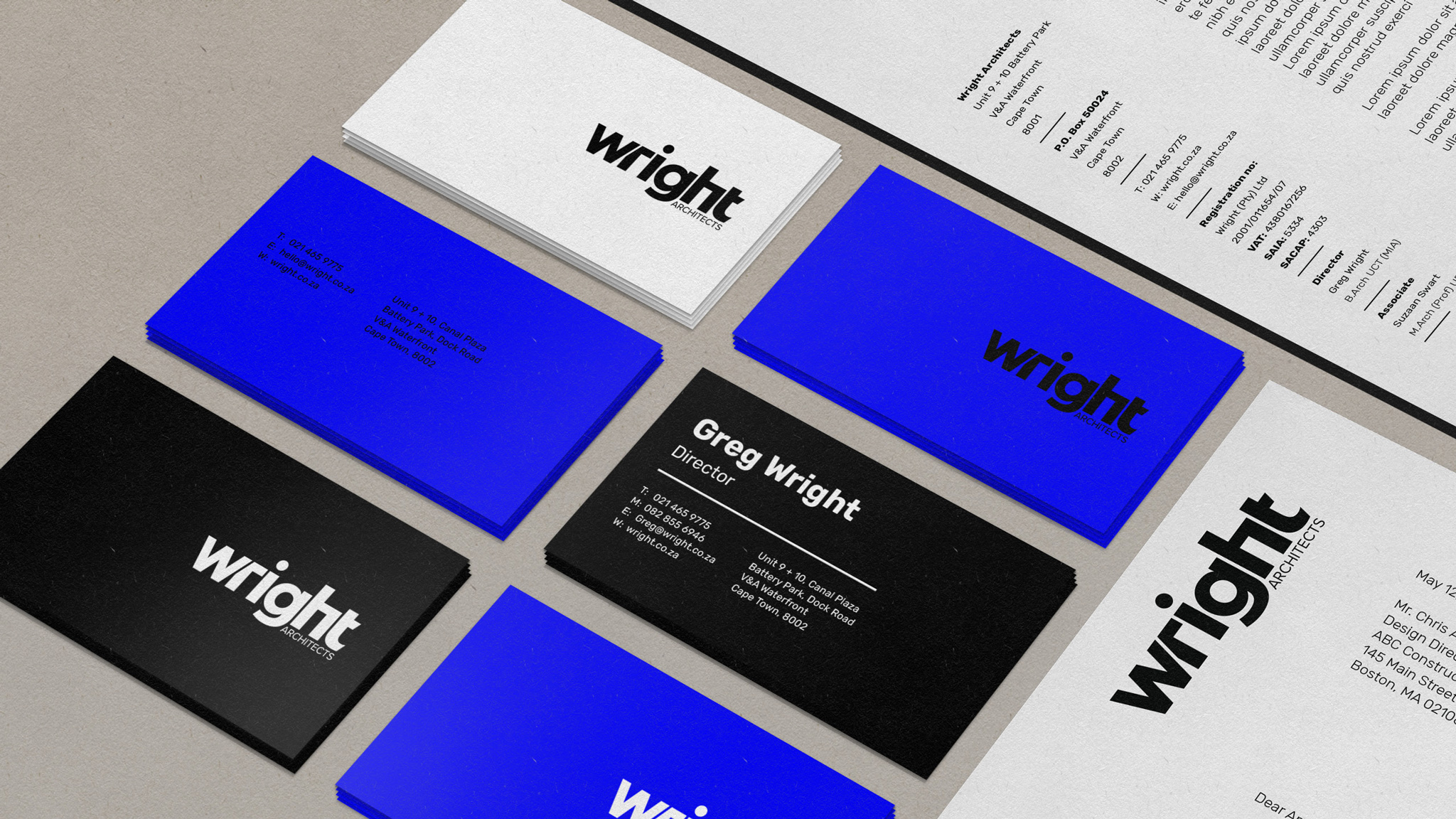 Wright Architects business cards in black, blue, and white